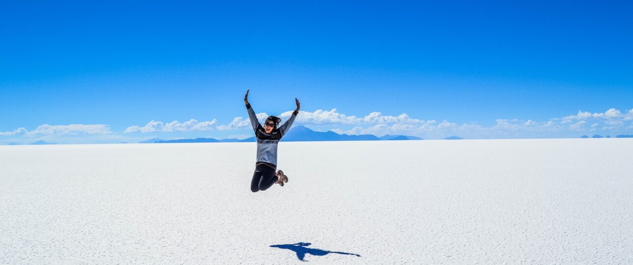 Tourist jumping Salt Flats, Uyuni, Bolivia